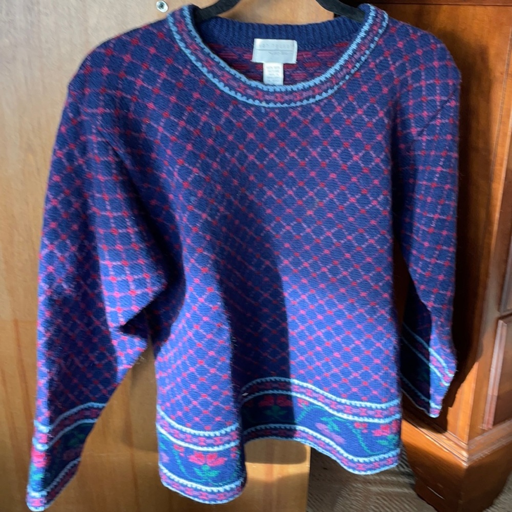 Van Heusen for her sweater size S.